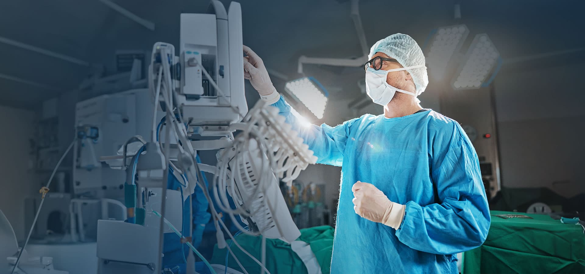 Surgeon in operating room with medical equipment